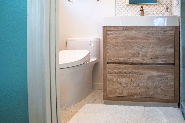 bathCRATE Mercury Way - The scallop backsplash + shower floor tile also creates a fun and beautiful focal point. We just love the way the colors and finishes came together on this project, and it certainly was a dramatic difference from its original condition! bathCRATE Mercury Way - The scallop backsplash + shower floor tile also creates a fun and beautiful focal point. We just love the way the colors and finishes came together on this project, and it certainly was a dramatic difference from its original condition!