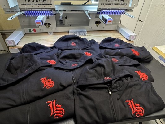 Lua Studios Full-Zipper Hoodie - Client supplied black Full-zipper hoodies requesting his logo on 3D puff embroidery option with top logo in flat embroidery. Lua Studios Full-Zipper Hoodie - Client supplied black Full-zipper hoodies requesting his logo on 3D puff embroidery option with top logo in flat embroidery.