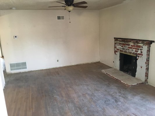 Tile Fireplace and New Laminate Flooring. - Old home in need of some TLC received a new tile facelift on broken down fireplace, and a stunning laminate flooring that is durable and will last for many years to come!!!