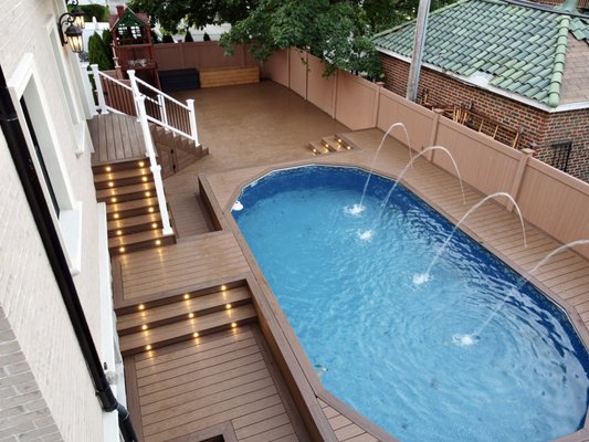 Flushing Pool Deck - This is what a no maintenance backyard looks like! With limited space we created as much storage as possible. House porch with double staircase provides dry storage for all the pool equipment and pool deck it self has storage for anything els you might need. Flushing Pool Deck - This is what a no maintenance backyard looks like! With limited space we created as much storage as possible. House porch with double staircase provides dry storage for all the pool equipment and pool deck it self has storage for anything els you might need.