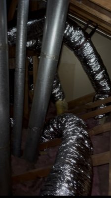 Ductwork replacement - Replaced the deteriorating gray flexible ductwork and existing supply and return air registers. Sealed all duct connections to prevent air leakage and properly supported and secured the duct system with appropriate strapping. Installed balancing dampers to improve airflow distribution and allow for proper system balancing.