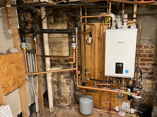 Tankless Water Heater Installation - Our team recently completed a tankless water heater installation in a Northern VA home. The project arose from the failure of the existing traditional water heater, necessitating a reliable and energy-efficient replacement. Our team assessed the situation and recommended a tankless water heater for its on-demand hot water capability, energy efficiency, and space-saving design. The installation involved the removal of the old unit, updating the plumbing and electrical systems to accommodate the new heater, and ensuring optimal performance through rigorous testing. The homeowner now enjoys consistent and efficient hot water thanks to our dedicated team! Tankless Water Heater Installation - Our team recently completed a tankless water heater installation in a Northern VA home. The project arose from the failure of the existing traditional water heater, necessitating a reliable and energy-efficient replacement. Our team assessed the situation and recommended a tankless water heater for its on-demand hot water capability, energy efficiency, and space-saving design. The installation involved the removal of the old unit, updating the plumbing and electrical systems to accommodate the new heater, and ensuring optimal performance through rigorous testing. The homeowner now enjoys consistent and efficient hot water thanks to our dedicated team!