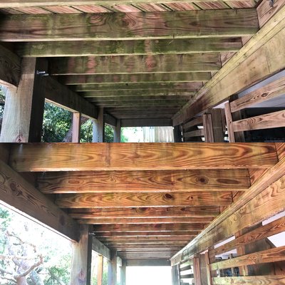 Deck Softwashing in Coralla - This is a recent example of our algae and wood mold cleaning from beneath a deck in Coralla, NC.