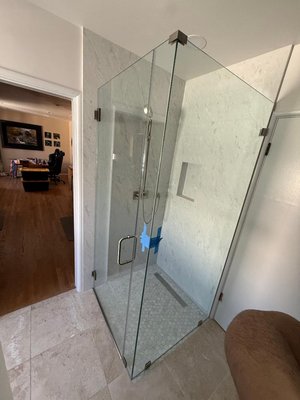Bathroom Remodel - This bathroom remodel was done for our customer who wanted to convert her old shower into a new curbless shower including using slabs for the walls and a linear drain. We also installed new tile flooring, fixtures and frameless glass to complete the look. We also incorporated a automatic moisture sensing fan for a seamless experience. Bathroom Remodel - This bathroom remodel was done for our customer who wanted to convert her old shower into a new curbless shower including using slabs for the walls and a linear drain. We also installed new tile flooring, fixtures and frameless glass to complete the look. We also incorporated a automatic moisture sensing fan for a seamless experience.