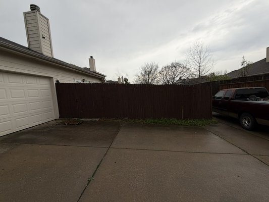 A new Fence Installation - The old fence was a side-by-side style with wooden posts, and the client decided on a board-on-board style with metal posts. A new Fence Installation - The old fence was a side-by-side style with wooden posts, and the client decided on a board-on-board style with metal posts.