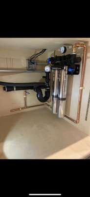 Under Sink Water Purification /Tankless Water Heater Installation - Shutdown the water and drain the system.
Remove existing isolation valves and sand down copper stub outs.Install 1/2” lead free ball valves and pipe in tankless water heater.Bring water line over and secure to inside of cabinetry with 1/2” plastic pipe clamps.
Reduce system from 3/4” to 1/2” and pipe filtration system on the side of the cabinet.Outlet side will come out into a isolation valve and t off for a future cold water feed.