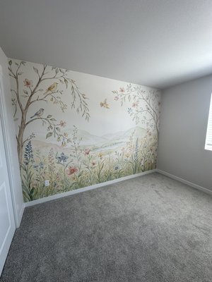 Floral Mural Wallpaper Installation - Custom floral mural wallpaper installation on a full accent wall. The mural was carefully installed with precise panel alignment and clean finishing along the ceiling, corners, baseboards, and outlets, creating a seamless feature wall.