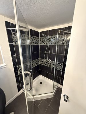 Bathroom remodel - Customer needed a bathroom remodel and flooring demo on short notice. We were able to demo 1400 sqft of tile floors, remove mortar and prep the floor for lvp installation. We remodeled the primary bathroom and installed a barn door