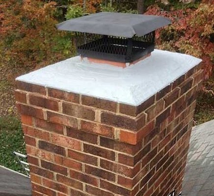 Chimney Crown Repair - This Chimney was cracked and we repaired it using a special Crown Repair Mortar which helps shed water. Chimney Crown Repair - This Chimney was cracked and we repaired it using a special Crown Repair Mortar which helps shed water.