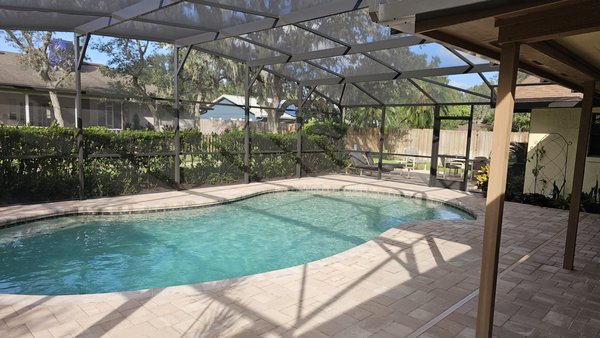 Pool deck remodel and new pool enclosure - We removed the  old pool enclosure and re-surfaced the pool deck with new pavers and coping.