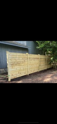 Wood Fencing - Beautifully crafted wood fencing adds privacy and timeless curb appeal to any yard.