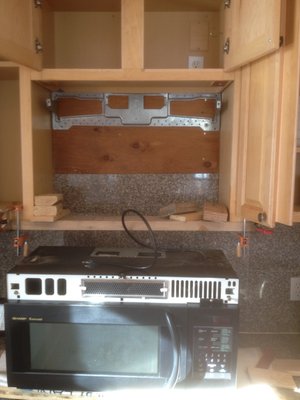 New Over-the-stove Microwave - Customer purchased new over-the-stove microwave.  Remove old microwave and install new one.