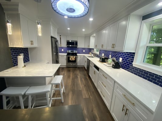 Kitchen Remodel - This remodel was done on a small older kitchen. Before demo the was a wall where the fridge is currently. Taking that wall out really opened up the space for options. We helped this client pick all the materials from what we have to offer. Clients were thrilled with the way our design team utilized the space. Kitchen Remodel - This remodel was done on a small older kitchen. Before demo the was a wall where the fridge is currently. Taking that wall out really opened up the space for options. We helped this client pick all the materials from what we have to offer. Clients were thrilled with the way our design team utilized the space.