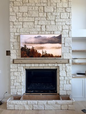 Samsung Frame TV above fireplace - Frame tv install on a rock surface concealing one connect box for a clean setup. Samsung Frame TV above fireplace - Frame tv install on a rock surface concealing one connect box for a clean setup.