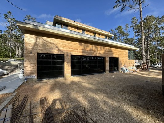 Clopay Avante Black Frame with Black Laminate Glass - New Construction installation for a local builder who choose our glass garage doors for their home. Clopay Avante Black Frame with Black Laminate Glass - New Construction installation for a local builder who choose our glass garage doors for their home.