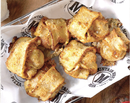 Sides - These are Not your average Knots! Featuring our signature dough made in-house daily folded around layers of garlic, butter, and cheese. Deliciously seasoned crinkle cut potato wedges, topped with cheese and crispy bacon and oven baked to perfection, with a fresh green onion garnish. Sides - These are Not your average Knots! Featuring our signature dough made in-house daily folded around layers of garlic, butter, and cheese. Deliciously seasoned crinkle cut potato wedges, topped with cheese and crispy bacon and oven baked to perfection, with a fresh green onion garnish.