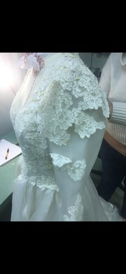 Vintage Bridal Gown Restoration - The vintage wedding gown from the 70’s which was stored in an attic for over 40 years had yellowed. The lace was hand dipped to brighten it. New fabric was purchased and the gown was recreated with fresh lace.