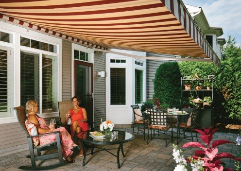 Awnings - Motorized awnings for the patio are an exceptional way to enhance your outdoor space, combining convenience, style, and functionality. With just the push of a button, you can easily extend or retract the awning, allowing you to control the amount of shade or sunlight on your patio. This makes your outdoor area more comfortable and usable throughout the day, whether you're looking to relax, dine, or entertain.

Motorized awnings not only protect you from the sun's harmful UV rays but also help shield your outdoor furniture from fading and damage. Additionally, they can reduce the indoor temperature by blocking direct sunlight from entering your home, leading to potential energy savings on cooling costs.

These awnings come in a variety of designs, colors, and materials, allowing you to choose an option that perfectly complements your home's exterior. The motorized feature adds a layer of luxury and ease of use, making it simple to adjust your outdoor environment to suit your needs. Whether you're seeking to create a shaded retreat or simply want to add a stylish element to your patio, motorized awnings are an excellent investment that can significantly enhance the enjoyment and value of your outdoor space.
