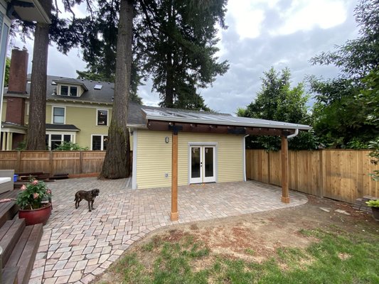 Irvington Garage, Patio Pavers, and Patio Cover Rebuild - 2024 - This garage was failing due to the proximity to an enormous old Doug fir, which had compromised the walls. We reframed, added sheathing, new siding, poured a new concrete pad, and removed the old patio cover that was pulling on one of the walls. The new garage is much more attractive, structurally sound, and the patio cover affords lots of light and headroom. The new pavers at the patio and driveway, which have custom drainage, are icing on the cake. Irvington Garage, Patio Pavers, and Patio Cover Rebuild - 2024 - This garage was failing due to the proximity to an enormous old Doug fir, which had compromised the walls. We reframed, added sheathing, new siding, poured a new concrete pad, and removed the old patio cover that was pulling on one of the walls. The new garage is much more attractive, structurally sound, and the patio cover affords lots of light and headroom. The new pavers at the patio and driveway, which have custom drainage, are icing on the cake.