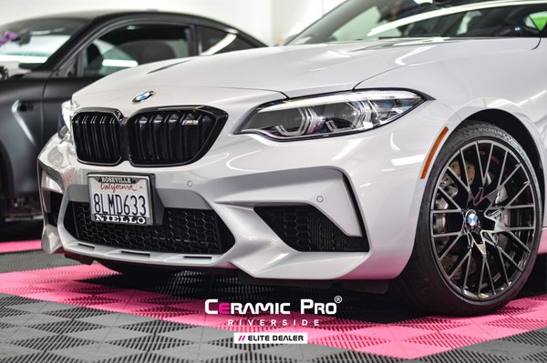 BMW M2C Clear Bra and Ceramic Coating - This 2022 BMW M2 Competition came in for some protection!

First, we performed a full exterior detail and paint correction. This removed swirls and contaminants from the surface to prepare the vehicle for paint protection film and our ceramic pro coating.

Once the prep was completed we wrapped the whole front end with paint protection film. We wrapped the Hood, Fenders, Front Bumper, Headlights, Mirrors, Door Edges, Door Cups, and luggage strip with our Kavaca Ceramic Coating clear bra. This will protect the high impact areas from rock chips, scratches and other minor impacts.

From there we applied 3 layers of our Ceramic Pro Ion coating to the exterior of this M2 - the paint, PPF, wheels, glass, and trims were all coated. This coating is backed by a lifetime warranty and will keep this car looking shiny and new for years.