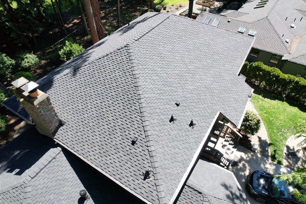 Amit's New Roof - We are proud to have lent our expertise on the new shingle installation project for this beautiful Sammamish home. Amit reached out to us with the requirement of a sturdy and visually appealing new roof. We used the CertainTeed Presidential TL shingles in a sleek charcoal color that not only enhanced the elegance of their home, but also promised superior longevity. Their home is now equipped with a top-notch roofing system that marries aesthetics with performance. It's always satisfying to deliver durable solutions to our customers' satisfaction.