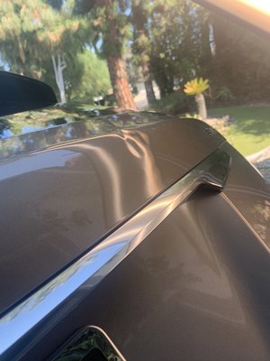 Cadillac SUV large dent rear hatch. One Day Mobile  service at the customers home￼ - Damage trunk area large dent