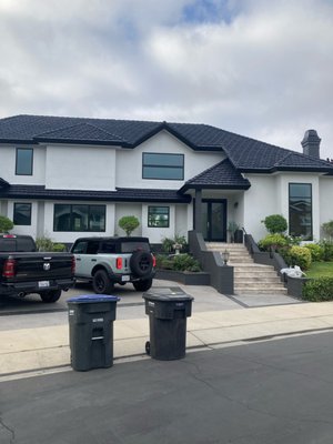 Full Window and Door Replacement Project - This is a full window replacement project.Milgard trinsic black on black windows and LaCantina doors specifically fit and customized for their home. The new windows updated the home to a new, modern look.