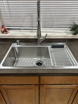 Kitchen sink replacement - Replaced sink, faucet, and garbage disposal with precision. Enlarged countertop tile opening to fit the new sink seamlessly, ensuring a modern and functional kitchen upgrade. Kitchen sink replacement - Replaced sink, faucet, and garbage disposal with precision. Enlarged countertop tile opening to fit the new sink seamlessly, ensuring a modern and functional kitchen upgrade.
