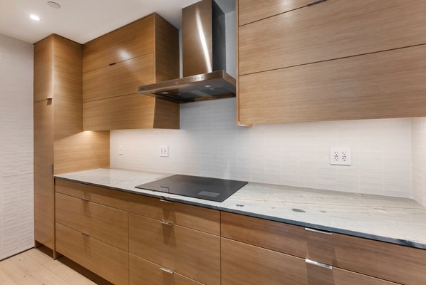 Japanese-Inspired Kitchen Remodel - Japanese-Inspired Kitchen Remodel. Clean lines, warm wood tones, and a focus on simplicity — this kitchen embodies modern Japanese minimalism.

🌿 Custom light wood cabinetry with perfectly aligned grain
🔹 Smooth, handle-free design for a seamless look
🍳 Flat stovetop built right into the granite

Every detail was crafted for balance, flow, and functionality — calm and beauty in every corner.