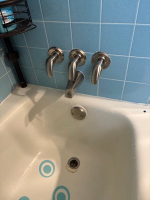 Tub Fixture Replacement - Replaced worn tub fixtures and updated the trim for smoother operation and a clean finish. Verified proper fit, checked connections, and tested for leaks and steady water flow. Photos show the tub fixture setup after replacement.