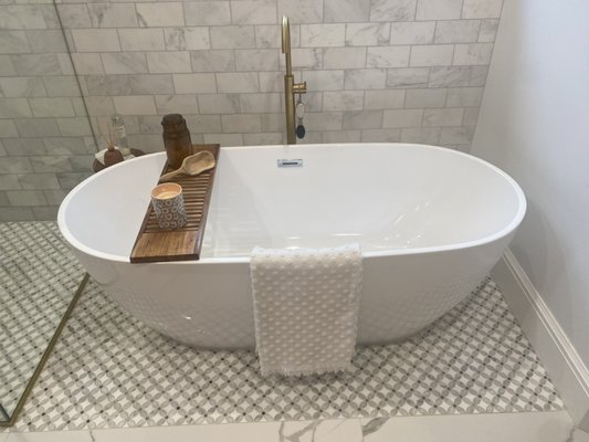 Bathroom remodel may 2022￼ - Hello there on this project Customer was asking to remodel bathroom. tile was installed￼ on the walls And on the flooring and also new sinks￼￼ and countertops were installed and a new tub as well￼.