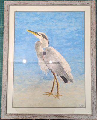 Stork Art Framing - At A&J Custom Framing, we take immense pride in our work and the relationships we build with our clients. One such cherished relationship is with our longtime friend and client, artist Jesse. Recently, we had the honor of framing one of Jesse's stunning pieces, a beautiful depiction of a stork.

The Artwork
Jesse's artwork captures the elegance and grace of a stork standing against a serene blue backdrop. The piece is a testament to Jesse's skill and attention to detail, showcasing the stork's intricate feathers and the tranquil atmosphere of its environment. The vibrant colors and lifelike representation make this artwork a true masterpiece.

The Framing Process
Framing this exquisite piece required careful consideration to ensure the final presentation complemented Jesse's vision. Here’s a detailed look at the steps we took to frame this artwork:

Consultation and Planning:
We began with a thorough consultation with Jesse to understand his preferences and the significance of the piece. Jesse expressed his desire for a frame that would not only protect the artwork but also enhance its visual appeal without overshadowing it.

Frame Selection:
Based on our discussion, we selected a frame that perfectly matched the artwork's aesthetic. We chose a rustic yet elegant frame with a distressed finish, which beautifully complements the natural subject of the stork and adds a touch of sophistication to the piece.

Matting:
The matting plays a crucial role in highlighting the artwork. We opted for a double mat with a clean white top mat and a subtle gray bottom mat. This choice added depth and drew attention to the artwork's intricate details. The mats were carefully cut to ensure precision and a flawless fit.

Glass Protection:
To protect the artwork while maintaining its visual clarity, we used museum-grade UV protective glass. This type of glass prevents harmful UV rays from damaging the artwork over time and reduces glare, ensuring the piece can be viewed from any angle without distraction.

Mounting:
Proper mounting is essential to preserve the artwork's integrity. We used archival-quality materials and techniques to mount the artwork securely. This approach ensures the piece remains in pristine condition and prevents any potential damage from the framing process.

Assembly:
The final assembly involved meticulous attention to detail. We carefully assembled the frame, mats, and glass, ensuring a snug and secure fit. Each component was cleaned and inspected to guarantee a dust-free and flawless presentation.

Quality Check:
Before delivering the framed artwork to Jesse, we conducted a thorough quality check. This step included verifying the stability of the frame, the clarity of the glass, and the precision of the matting. We aim for perfection in every project, and this was no exception.

Delivery:
Once satisfied with the framing, we arranged for a careful delivery of the artwork to Jesse. Seeing his reaction upon receiving the framed piece was incredibly rewarding. Jesse was thrilled with the final result, and we were honored to have played a part in enhancing his beautiful artwork.

The Result
The finished piece now stands as a testament to both Jesse's artistic talent and our commitment to quality craftsmanship. The rustic frame adds character while complementing the artwork's natural theme. The double matting highlights the vibrant colors and intricate details of the stork, creating a visually stunning presentation.

Client Feedback
Jesse's feedback was overwhelmingly positive. He appreciated the attention to detail and the careful consideration given to every aspect of the framing process. The final product not only met but exceeded his expectations, showcasing his artwork in the best possible light.

Conclusion
At A&J Custom Framing, we understand that each piece of art holds a special place in the heart of its creator. Our mission is to honor that sentiment by providing framing solutions that protect and enhance the artwork's beauty. Framing Jesse's stork painting was a fulfilling project that allowed us to demonstrate our expertise and dedication to our craft.

We look forward to continuing our relationship with Jesse and helping more artists bring their visions to life through our custom framing services. If you have a piece of art that deserves the best framing, visit us on Madison Avenue or call (212) 685-5588. Let us help you preserve and showcase your masterpieces with the same care and precision that we bring to every project.