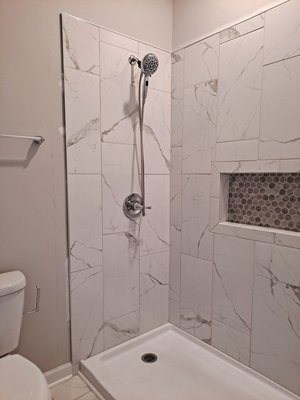 Offering bathroom remodeling service - This shower remodeling job was done for customer needing a walk in shower and not having to step over tub edge. Offering bathroom remodeling service - This shower remodeling job was done for customer needing a walk in shower and not having to step over tub edge.