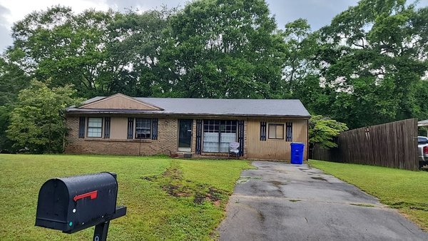 Shingle Roof Replacement with Gable & Tree Removed - This homeowner wanted to update to curb appeal and functionality of their roof. We removed a tree that was encroaching the left side of the house, removed a gable and installed a new Atlas asphalt shingle roof along with new soffit, fascia and gutters.