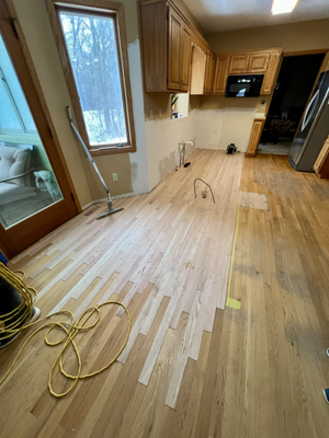 Prior Lake Damage Restoration - There was a homeowner in Prior Lake whose dishwasher exploded one evening while she was asleep and ruined her kitchen. We were called in to replace the wood floor and refinish the main level so everything blended together. We tied in the new floors to the existing oak boards, refinished it with a light stain to match the previous kitchen style, and coated it three times for protection. The homeowner loved the work, and the fact we got it done by New Year's Day so she could start the year off on the right foot. Prior Lake Damage Restoration - There was a homeowner in Prior Lake whose dishwasher exploded one evening while she was asleep and ruined her kitchen. We were called in to replace the wood floor and refinish the main level so everything blended together. We tied in the new floors to the existing oak boards, refinished it with a light stain to match the previous kitchen style, and coated it three times for protection. The homeowner loved the work, and the fact we got it done by New Year's Day so she could start the year off on the right foot.