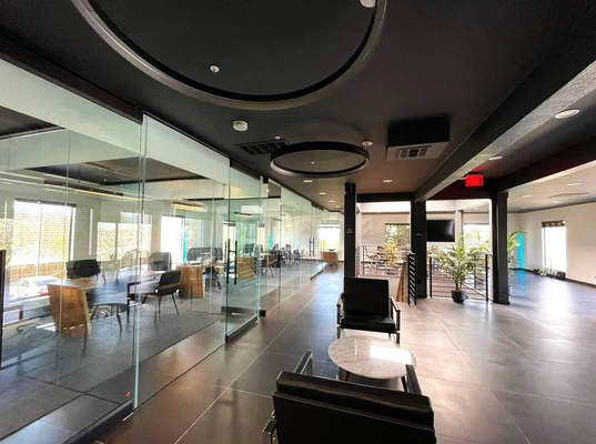 Law Firm offices in San Jose, CA - 10,000Sq.Ft. , 2 stories office in the heart of Santana Row in San Jose’. Full remodeling by Pianta Design. The client wanted an “open space” solution with modern, sleek and elegant materials. 

As you step through the sleek glass doors, you're greeted by a spacious atrium adorned with living green, midcentury modern creating a harmonious fusion of nature and technology. Soft ambient lighting casts a warm glow, guiding you towards the heart of the building. The second floor houses a vibrant co-working space, where flexible workstations and ergonomic furniture cater to diverse needs. Collaborative zones equipped with state-of-the-art multimedia facilities encourage dynamic brainstorming sessions, while soundproof pods offer privacy for focused tasks. Natural light floods through floor-to-ceiling windows, illuminating the open layout and fostering a sense of connectivity.