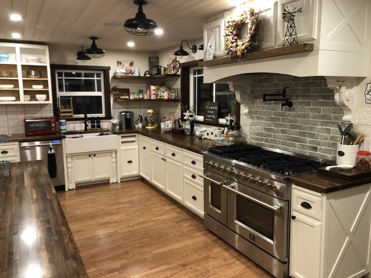 French Country Kitchen - This kitchen transformation is just nearing completion. After completely tearing out the old kitchen and completing plumbing, electrical and drywall, we custom crafted every cabinet, door and drawer face from raw lumber to the customer specifications. Created a special waterproof finish for the butcher block countertops, installed tile and appliances. Truly a wonderful transformation from an 80's kitchen to one that is spectacular!