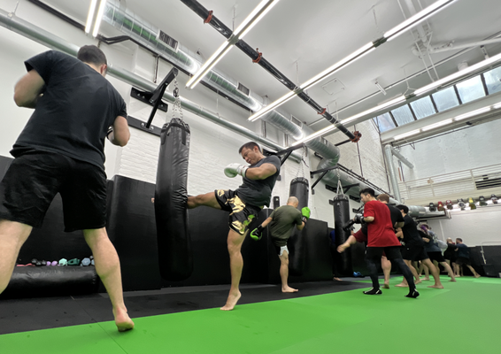 Technique & Conditioning - Being fight ready is about maintaining a healthy lifestyle and pushing to reach your fitness goals. Technique & Conditioning is an all levels class that combines kickboxing and Muay Thai workout techniques with functional calisthenics. This intense workout begins with a warm up, followed by 10 rounds on the heavy bag and conditioning circuits, ending with cool down and stretching to ensure proper recovery.
This class implements pro-fighting bag work and conditioning routines that challenge both the first time students as well as seasoned professionals. All movements are aimed to strengthen your full body and kickboxing skillset with a positive mindset. Technique & Conditioning - Being fight ready is about maintaining a healthy lifestyle and pushing to reach your fitness goals. Technique & Conditioning is an all levels class that combines kickboxing and Muay Thai workout techniques with functional calisthenics. This intense workout begins with a warm up, followed by 10 rounds on the heavy bag and conditioning circuits, ending with cool down and stretching to ensure proper recovery.
This class implements pro-fighting bag work and conditioning routines that challenge both the first time students as well as seasoned professionals. All movements are aimed to strengthen your full body and kickboxing skillset with a positive mindset.