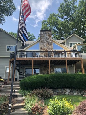 Deck Repair and update - This deck update completely changes the vibe to this Erskine Lake front home! Here we replaced damaged decking, added a spiral staircase and swapped out wooden rail for contemporary black metal.