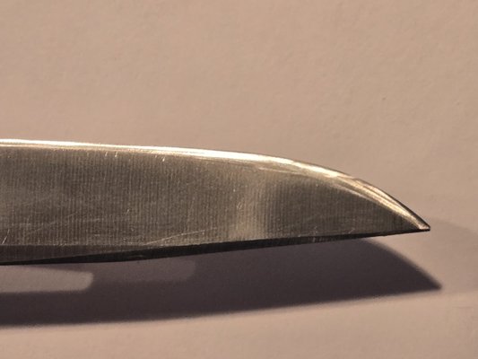 pocket knife before and after - This pocket knife was in bad shape when it was brought to me. There was a large chip in the tip of the blade, and the edge was dull and not cutting anything. After being sharpened on Simply Sharp's serious of whet stones the blade is not smooth, shiny, and honed to a razor edge. pocket knife before and after - This pocket knife was in bad shape when it was brought to me. There was a large chip in the tip of the blade, and the edge was dull and not cutting anything. After being sharpened on Simply Sharp's serious of whet stones the blade is not smooth, shiny, and honed to a razor edge.