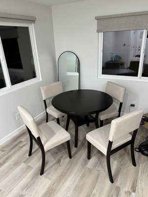 Dining Table and Chairs Assembly - Assembled a modern dining table with four upholstered chairs. A sturdy and stylish addition to the dining area, ensuring both comfort and functionality Dining Table and Chairs Assembly - Assembled a modern dining table with four upholstered chairs. A sturdy and stylish addition to the dining area, ensuring both comfort and functionality
