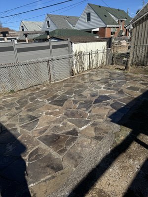 Flag Stone Patio - We designed and installed a natural flagstone patio to create a durable, timeless outdoor space. The project included full base prep, precision stone placement, and joint finishing for stability and drainage. A clean, rustic upgrade that blends seamlessly into the landscape.