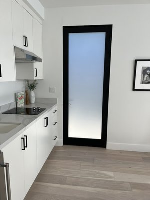 Residential Tint - In this project a frost tint was installed on the kitchen door for privacy purposes.