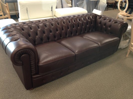 Classic Leather Couch - This couch was reupholstered to fit our client's more vintage vision for their home, in a classic brown genuine leather. Classic Leather Couch - This couch was reupholstered to fit our client's more vintage vision for their home, in a classic brown genuine leather.