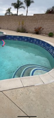 Remodel Pebble Finish - Home owner requested a modern look family friendly pool we added a Baja bench with modern color changing lights aqua white pebble finish and some sea animals for the kids to see.
