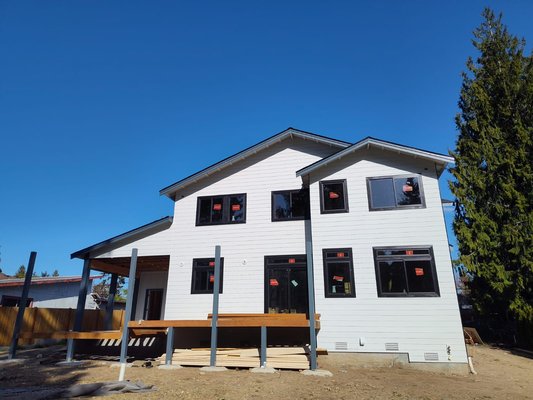 New Construction Exterior Painting - This new house was painted for a builder that I work for and he wanted white color on the siding with a dark gray on accent walls, trim, and fascia. also we stained the front entrance columns and ceiling.