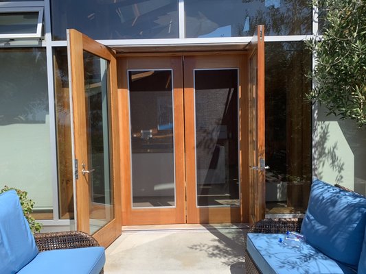 Retrofit wood sliding screen door re-screening in Santa Monica - Today we had the pleasure of working in a beautiful home in Santa Monica on the beach these two wooden French doors were retrofit with aluminum screen frames within the door we were able to remove them and completely re-screen them for the customer it turned out beautiful￼￼