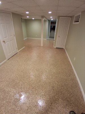 New Haven Basement - This project involves the professional preparation and installation of a high-performance, multi-coat epoxy flooring system in a residential basement located in New Haven, Connecticut. The primary objective is to transform an unfinished, damp-prone concrete basement into a durable, moisture-resistant, and aesthetically pleasing living space. The finished floor will provide a seamless, easy-to-clean surface that safeguards the home against regional moisture challenges while significantly boosting property value.