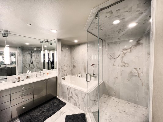 Master Bath, Bed and Closet Remodel - This was a fun "master wing" remodel in an older high-rise condo. What used to be a guest bathroom, TV room and storage closet transformed into the master bath, bed and closet. The bathroom was covered wall to wall in mirrors with dark corners for the shower and tub. We transformed the space by exposing the shower and tub and minimizing the use of mirrors. The closet expanded to create an amazing walk-in closet with endless storage. Since the original TV room was taken by the bedroom, a small room off of the master-wing turned into a moody hang-out space to read a great book or watch TV with the family! Master Bath, Bed and Closet Remodel - This was a fun "master wing" remodel in an older high-rise condo. What used to be a guest bathroom, TV room and storage closet transformed into the master bath, bed and closet. The bathroom was covered wall to wall in mirrors with dark corners for the shower and tub. We transformed the space by exposing the shower and tub and minimizing the use of mirrors. The closet expanded to create an amazing walk-in closet with endless storage. Since the original TV room was taken by the bedroom, a small room off of the master-wing turned into a moody hang-out space to read a great book or watch TV with the family!