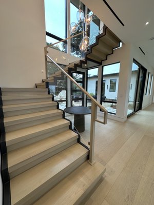 Sawtooth Stair - This steel sawtooth stair was made to receive wood treads and risers. We custom fabricated a steel railing system that the client put glass panels in. Sawtooth Stair - This steel sawtooth stair was made to receive wood treads and risers. We custom fabricated a steel railing system that the client put glass panels in.